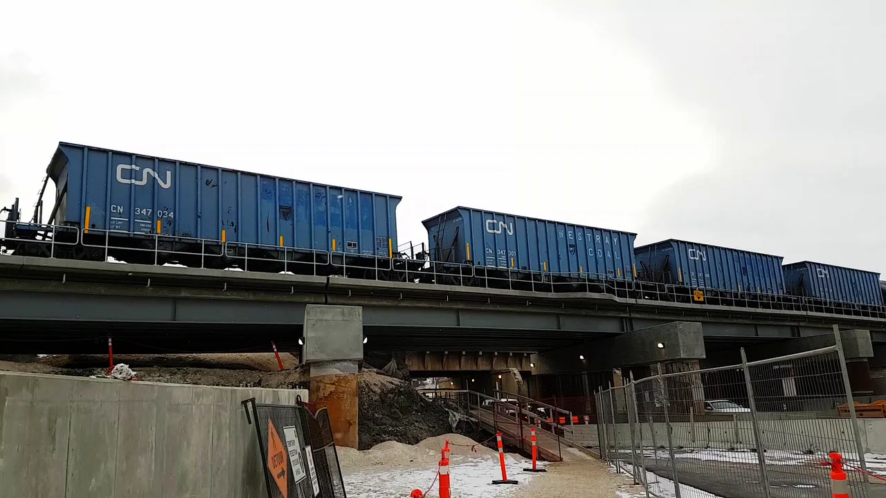 Four CN Westray Coal Hoppers heading west through Winnipeg, MB. Left to Right: CN 347034, 347001, 347006, 347028