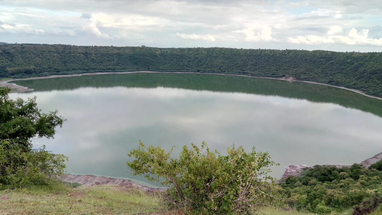 This huge dent is a crater lake formed by a meteorite impact 50,000+ years ago.